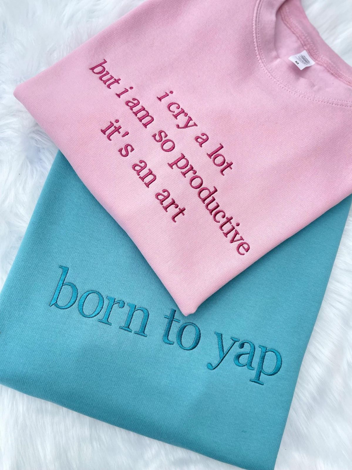 Pink and turquoise sweatshirts with embroidered quotes — Pinterest inspiration