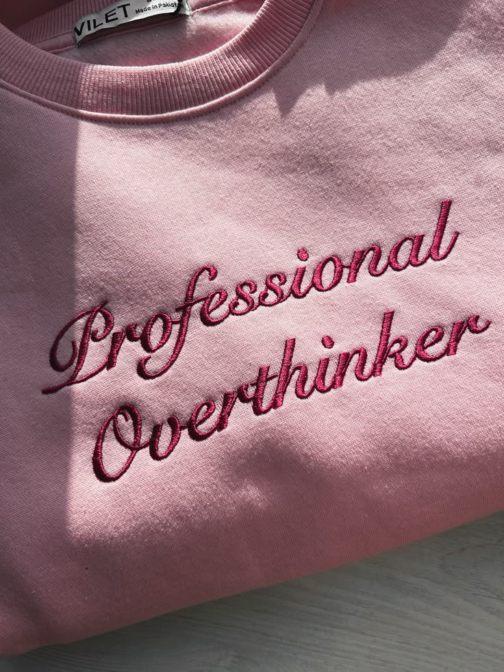 Pink sweatshirt with cursive embroidered wording — Pinterest inspiration
