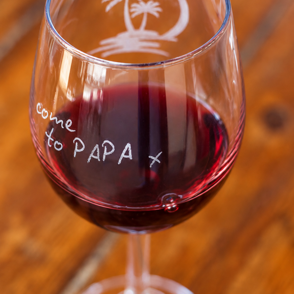 Engraved lettering detail for PAPAS on a wooden table