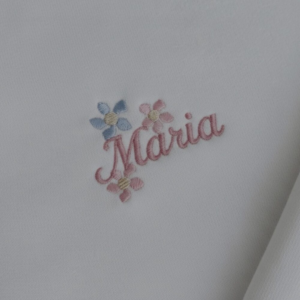 Pink Maria name embroidery with pink and blue flowers