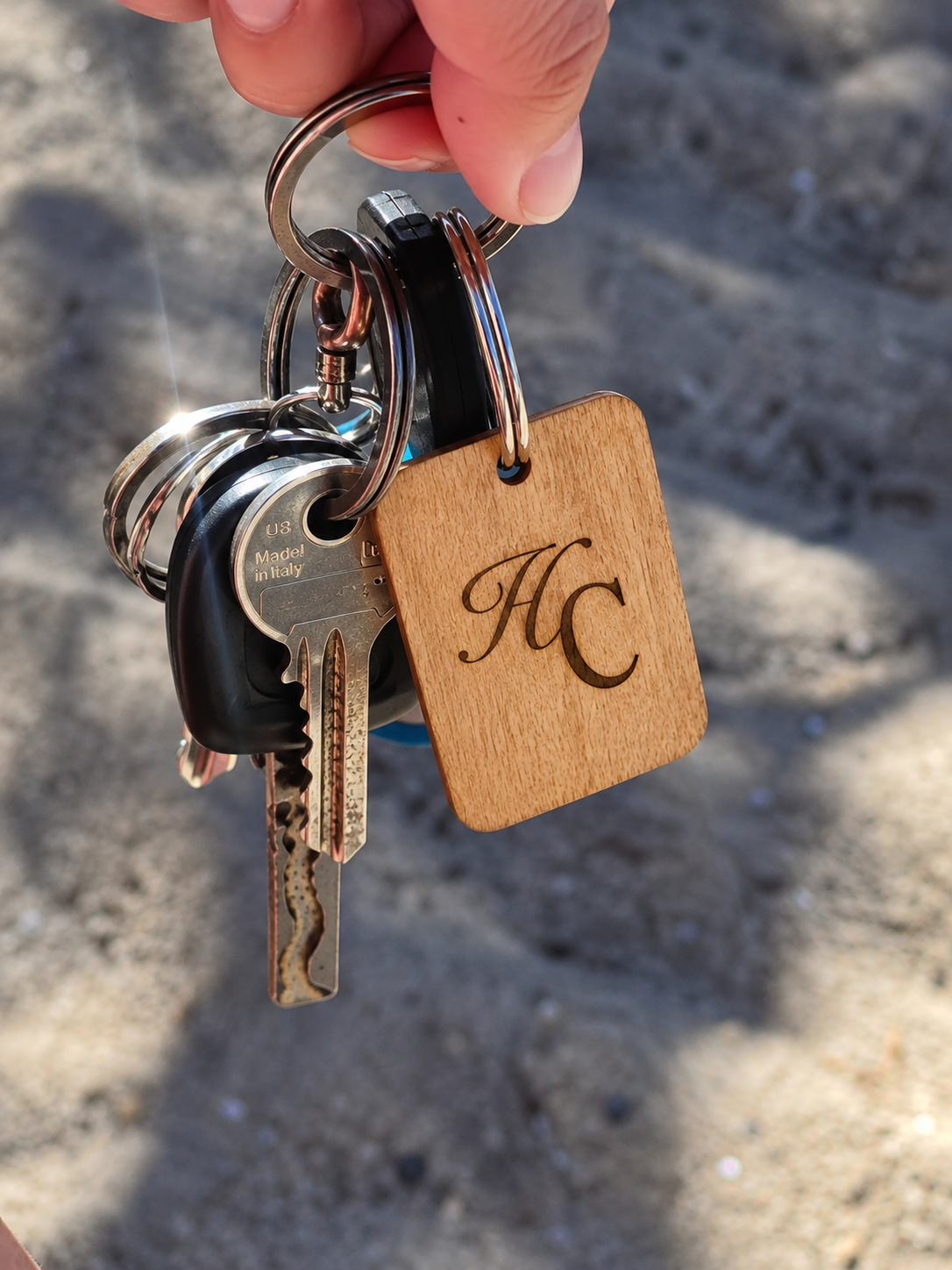 Laser-engraved wooden wedding keychain, Design 1 — intertwined initials